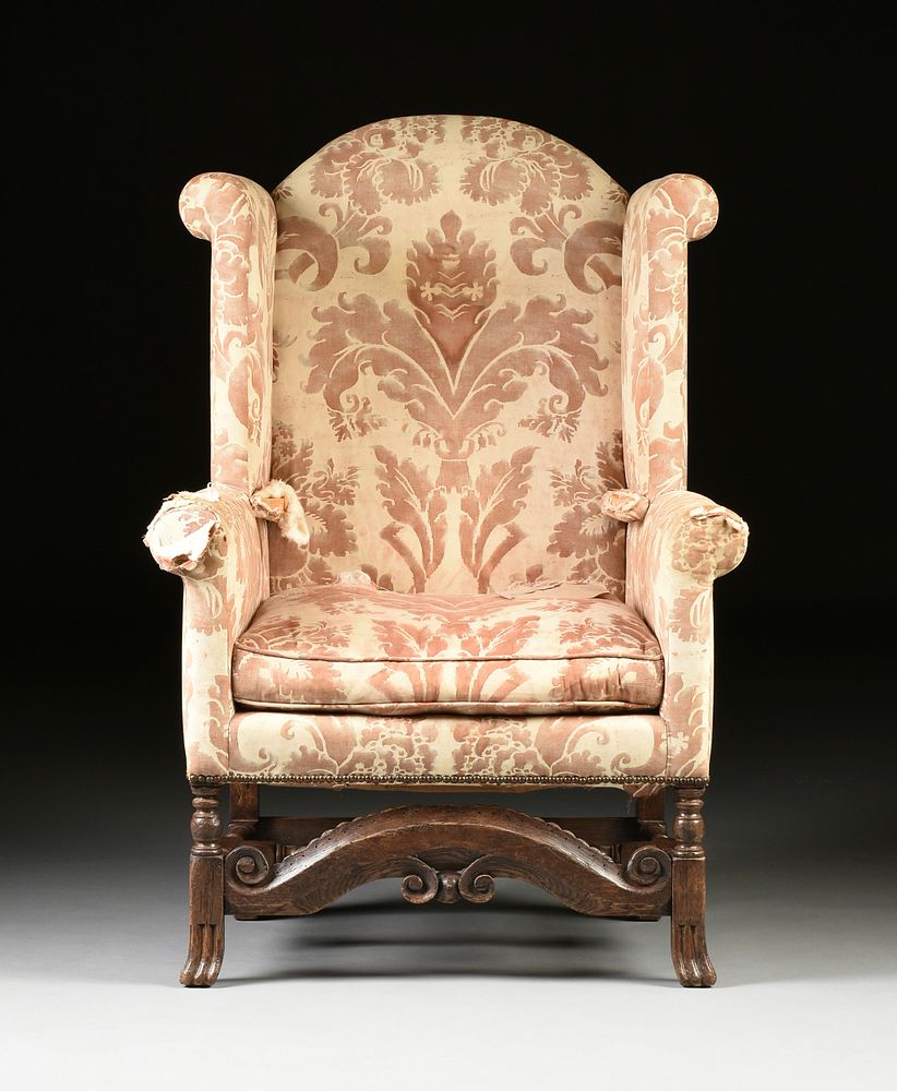 Appraisal: A WILLIAM AND MARY CARVED OAK AND UPHOLSTERED WINGBACK ARMCHAIR