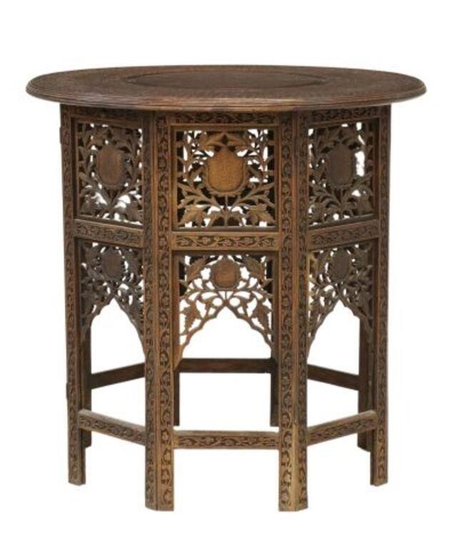 Appraisal: Carved rosewood side table India floral carved band centering brass