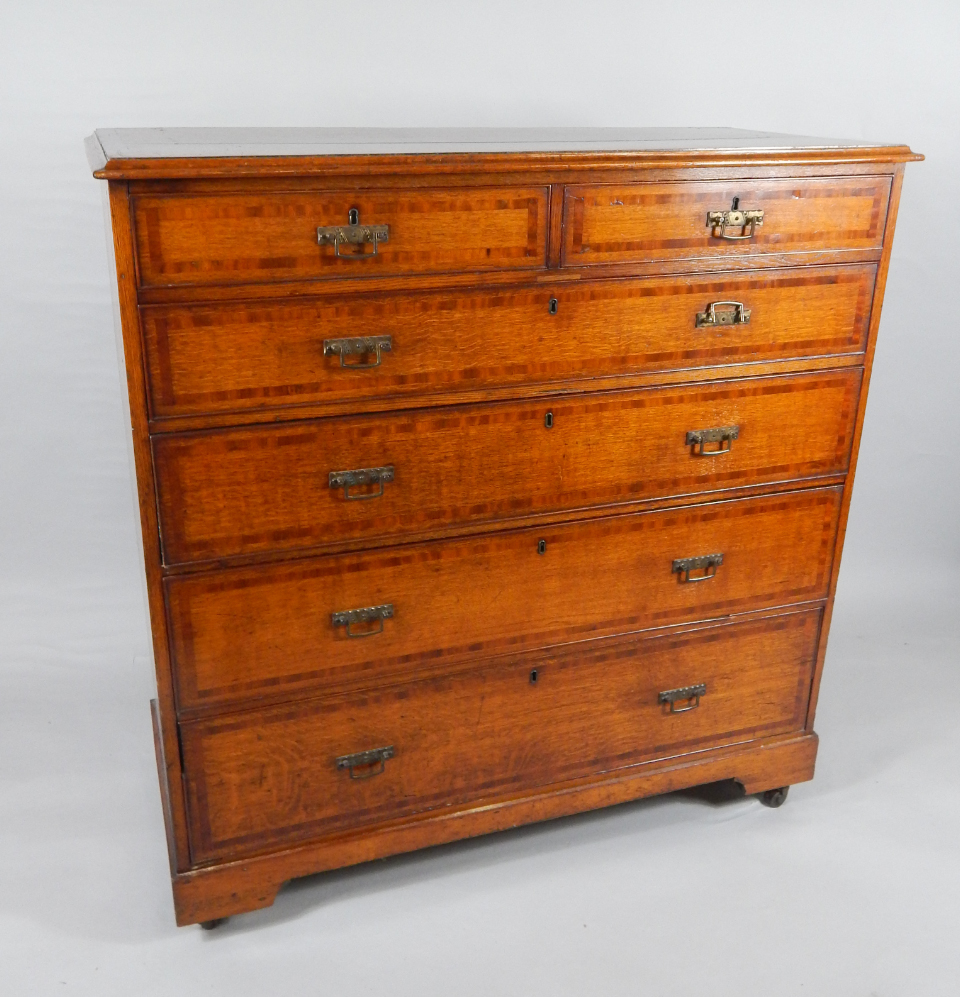 Appraisal: A Victorian oak and yew wood crossbanded chest of drawers