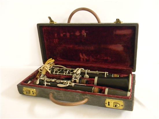 Appraisal: F Barbier brown wooden clarinet in fitted case No some