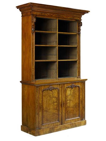 Appraisal: A mid Victorian burr walnut library bookcase the broad projecting