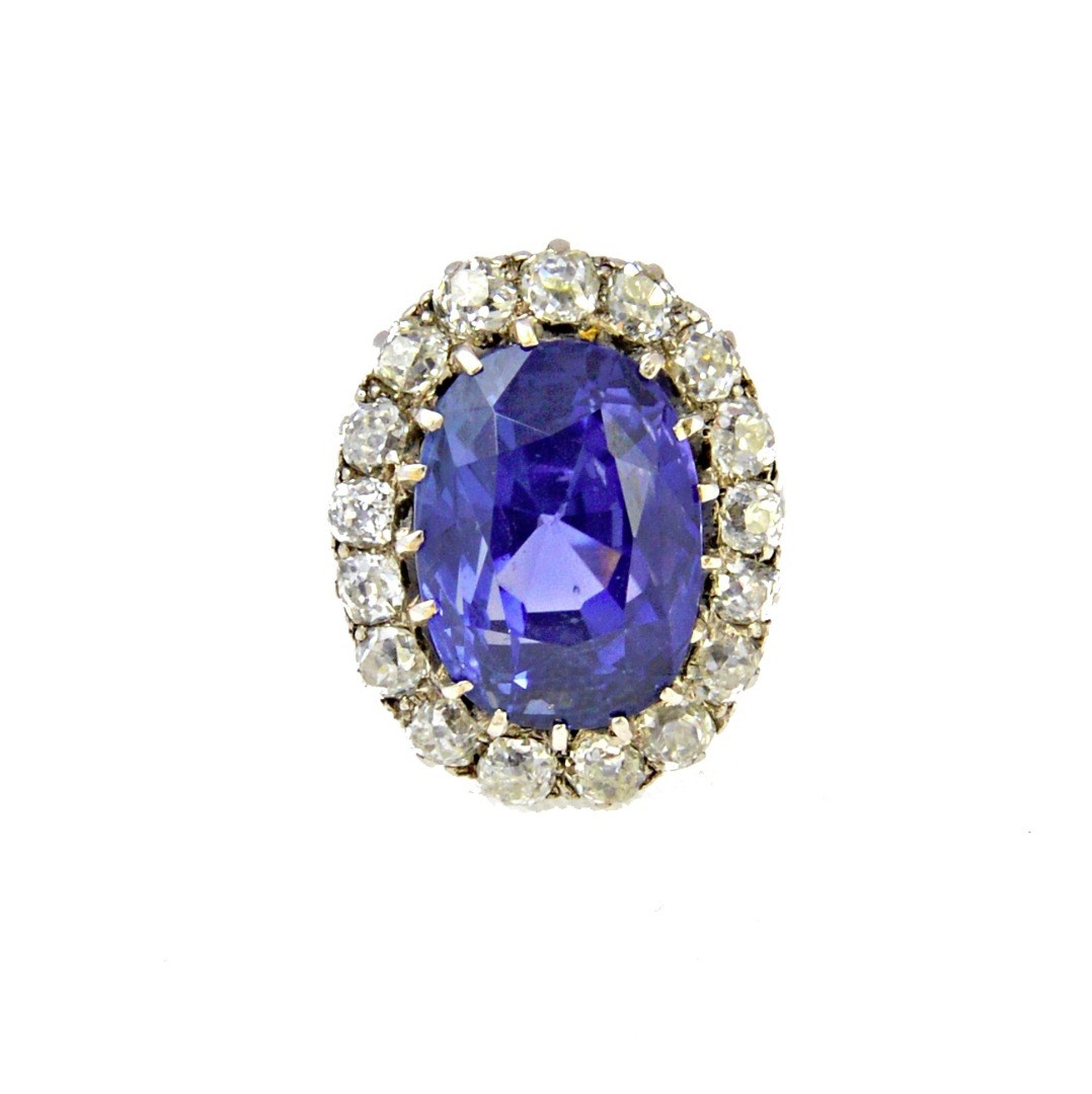 Appraisal: A white gold sapphire and diamond set oval cluster ring