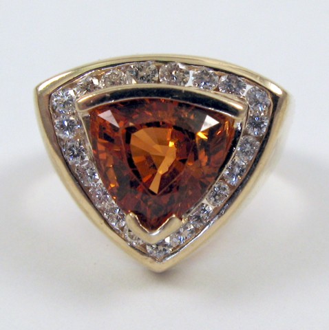 Appraisal: CITRINE DIAMOND AND FOURTEEN KARAT GOLD RING centering a trillion-cut