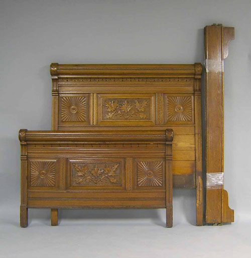 Appraisal: Victorian oak double bed ca with a carved headboard and