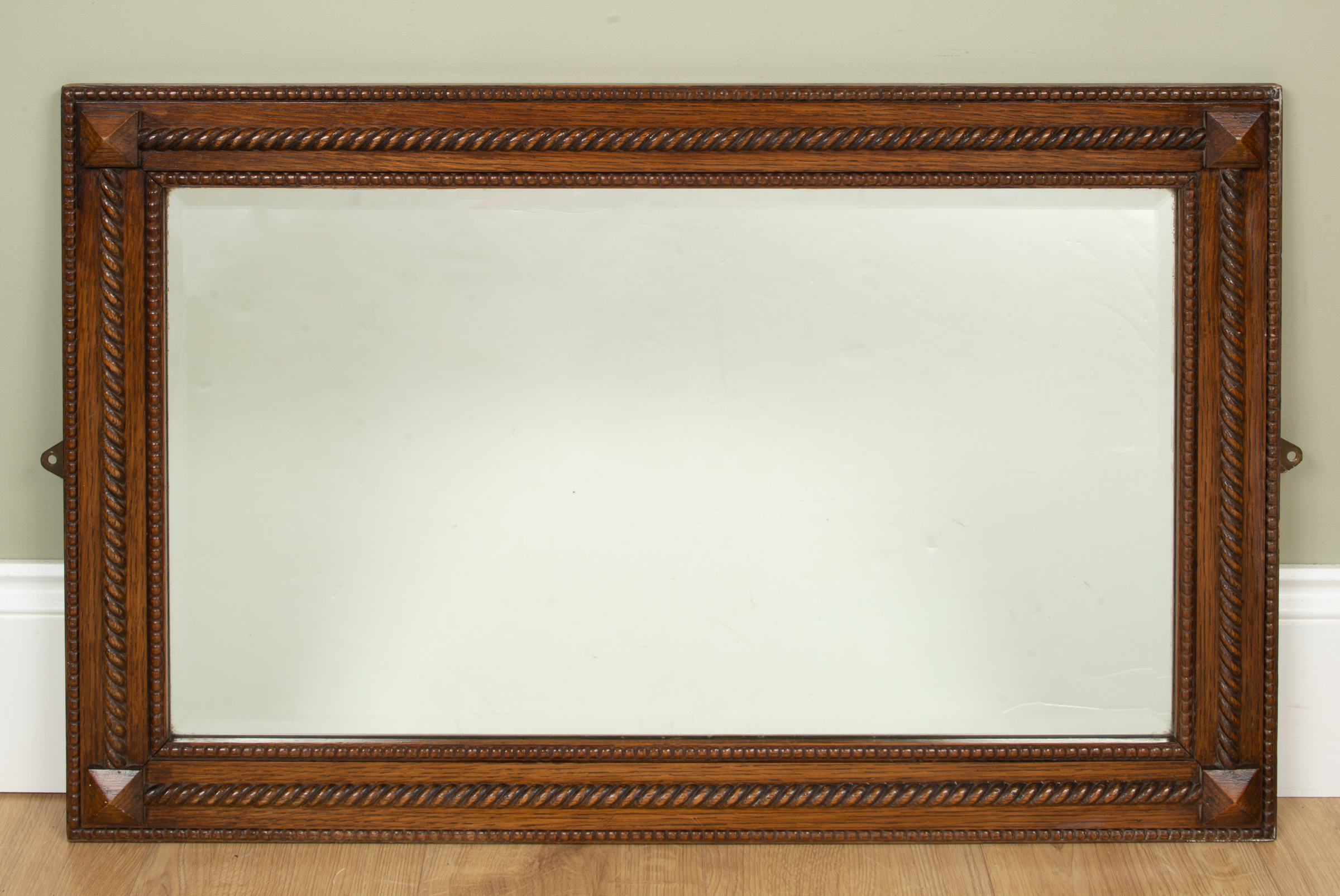 Appraisal: An early th century oak framed rectangular wall mirror with