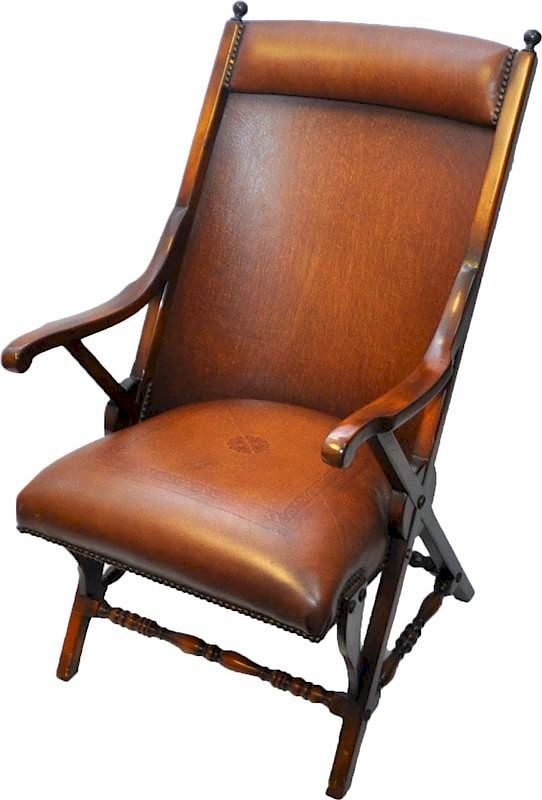 Appraisal: THEODORE ALEXANDER MAHOGANY LEATHER CAMPAIGN CHAIR A Theodore Alexander mahogany