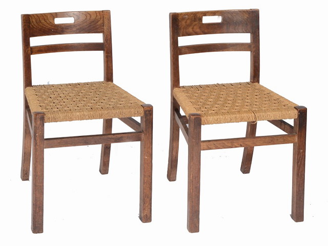 Appraisal: A PAIR OF HEALS LIMED OAK SIDE CHAIRS with rush