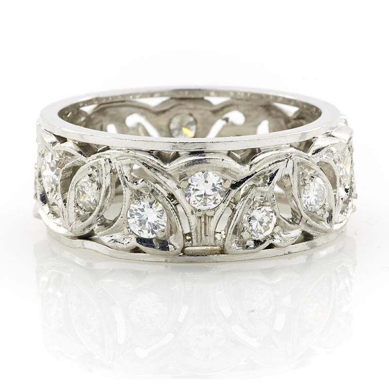 Appraisal: Platinum and diamond carved band Platinum and diamond carved band