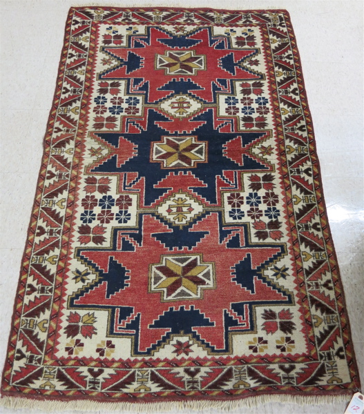 Appraisal: HAND KNOTTED TRIBAL RUG Caucasian Kazak design hand knotted '