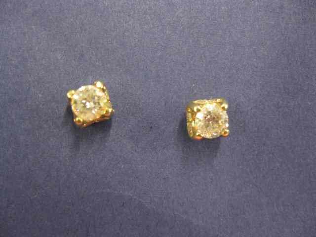 Appraisal: Diamond Earrings center diamondsurrounded by smaller diamonds carat total in