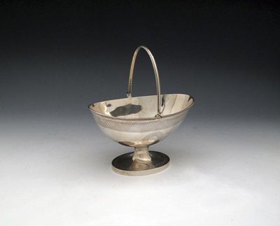 Appraisal: A silver swing-handled sugar basket by James and Herbert Barraclough