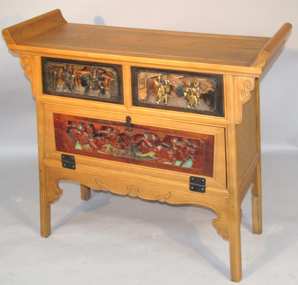 Appraisal: A thC oriental design hardwood side cabinet with scroll ends