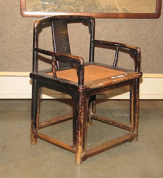 Appraisal: A provincial black lacquered wood chair Qing Dynasty Built with