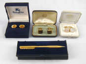 Appraisal: A mixed lot comprising a pair of Burberrys gilt cufflinks