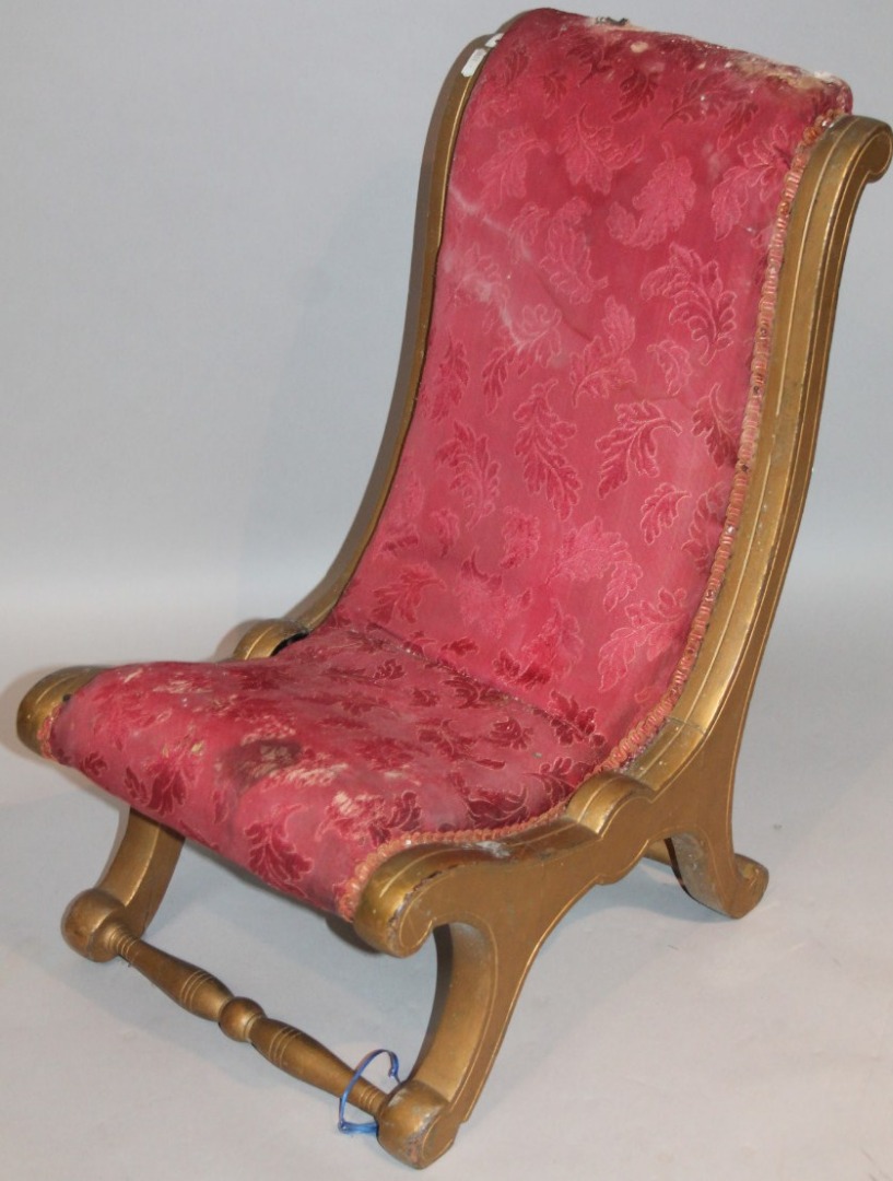 Appraisal: An Edwardian scroll frame child's chair upholstered in red floral