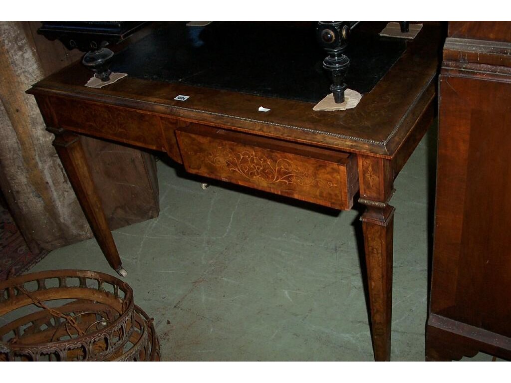 Appraisal: A th century walnut desk fitted with frieze drawers with