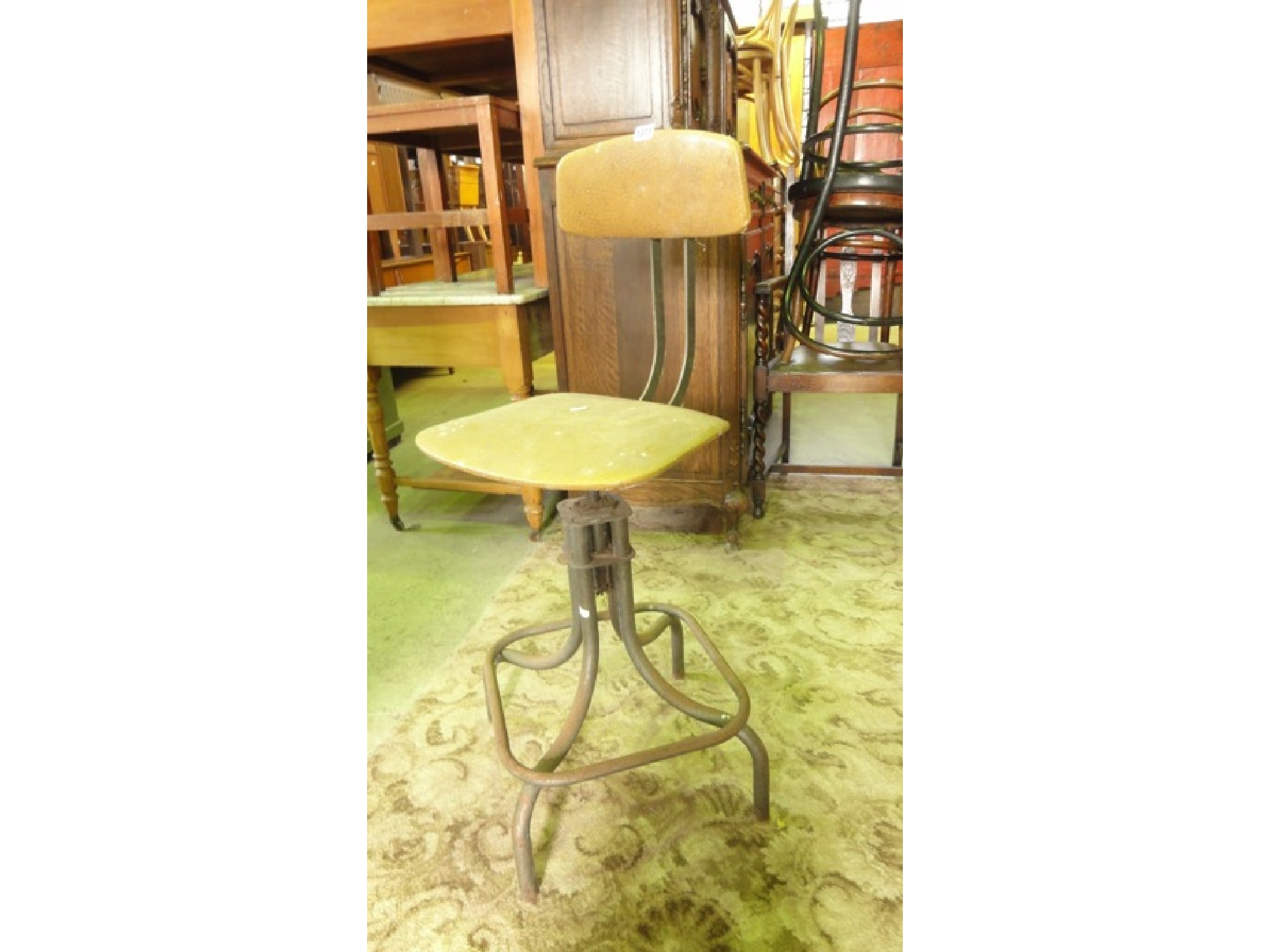 Appraisal: A vintage industrial style machinist typists type chair with adjustable