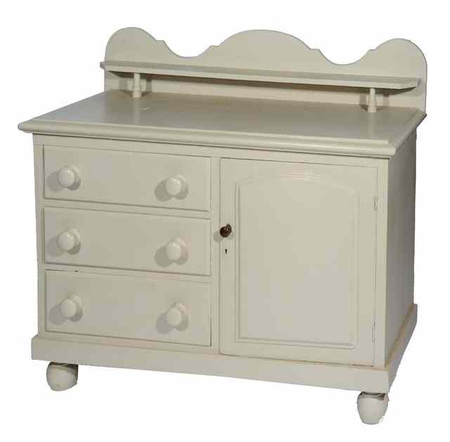 Appraisal: AN ANTIQUE CREAM PAINTED PINE LINCOLNSHIRE DRESSER with raised shaped