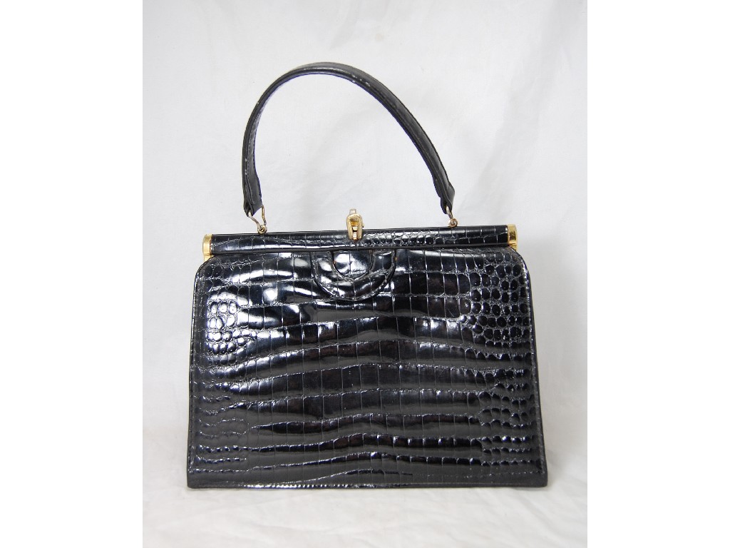 Appraisal: A black crocodile skin vintage handbag