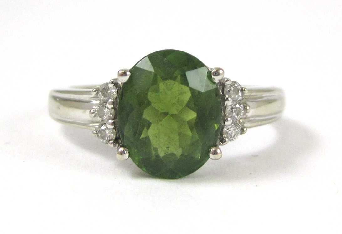 Appraisal: GREEN TOURMALINE AND FOURTEEN KARAT GOLD RING The white gold