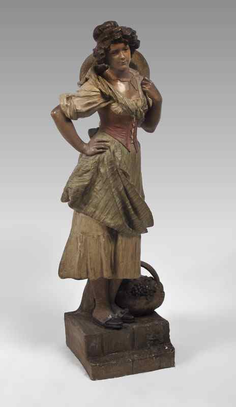 Appraisal: LARGE GOLDSCHEIDER POLYCHROMED STATUE Depicting a Maiden with Basket signed