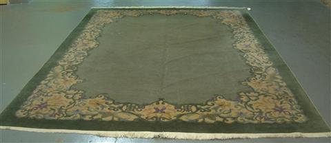 Appraisal: GREEN AND PINK FLORAL CHINESE NICHOLS AREA RUG w d