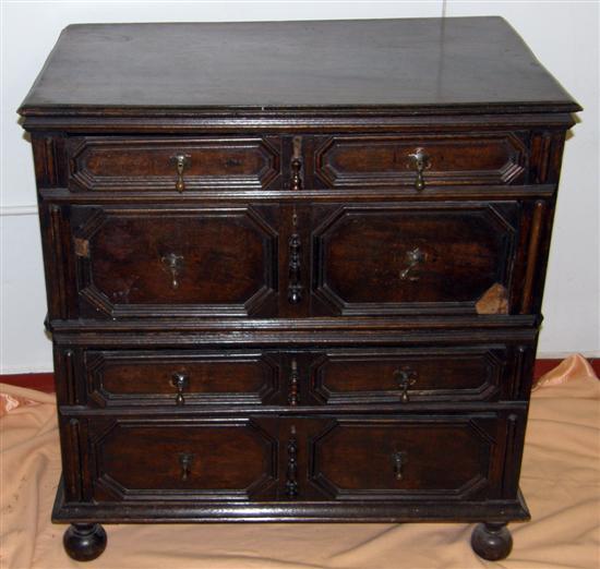 Appraisal: AN OAK CHEST on bun feet with four long drawers