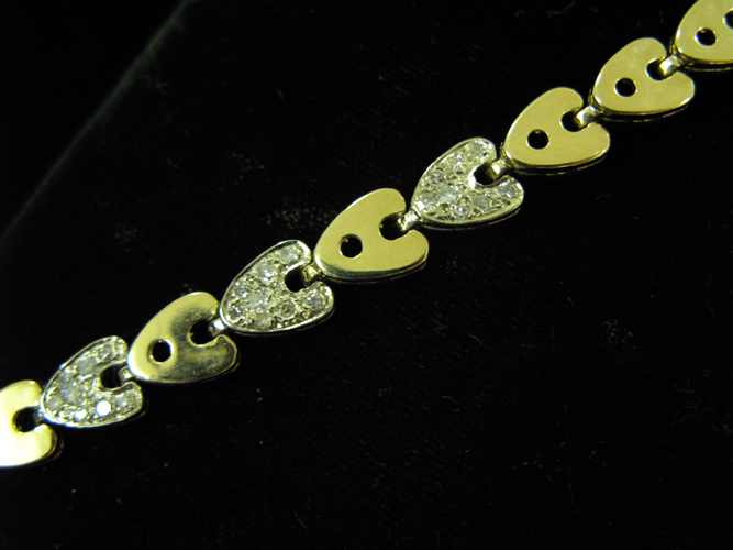 Appraisal: DIAMOND AND FOURTEEN KARAT GOLD LINK BRACELET with yellow and