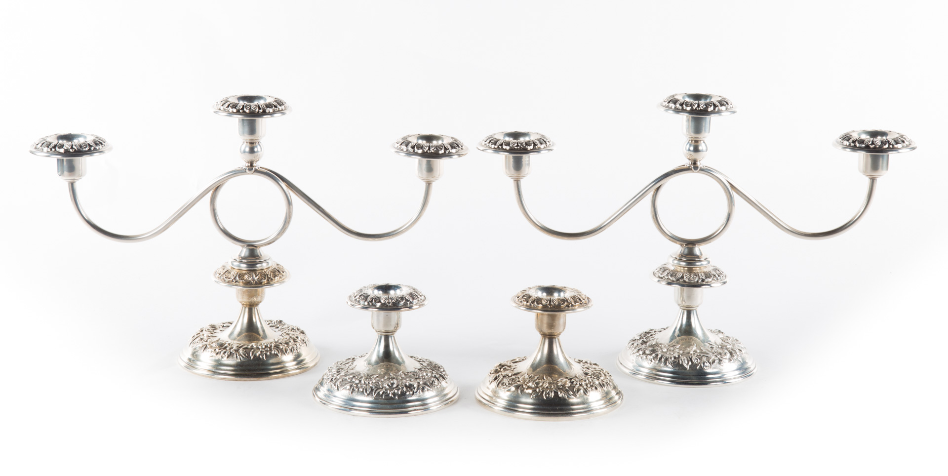 Appraisal: Four Kirk weighted sterling low candlesticks and two three-light candelabra