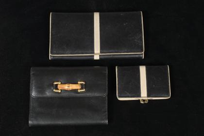 Appraisal: Three Gucci wallets PROVENANCE The collection of Ann B Ritt