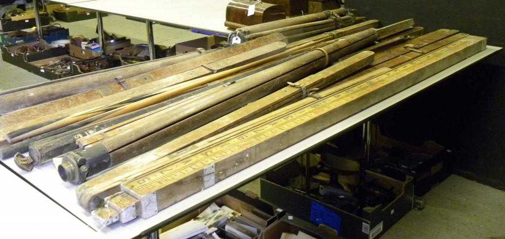 Appraisal: A quantity of surveyor's wooden staffs tripods etc