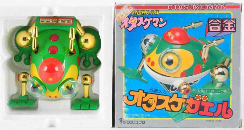 Appraisal: Otasukeman Frog Takatoku Quirky and beloved Frog Otasuke-Gaeru features gold