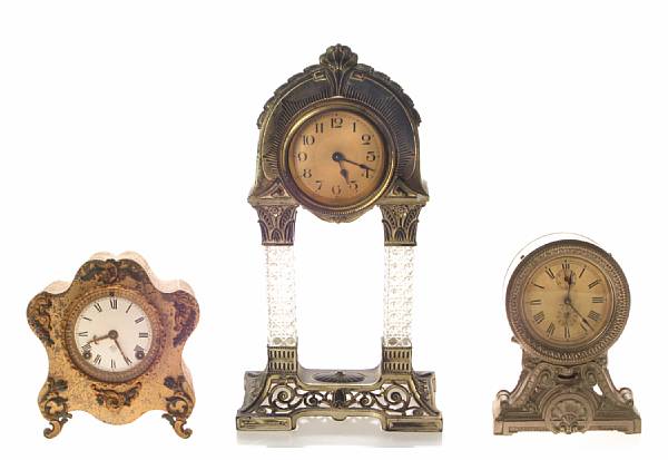 Appraisal: A group of three patinated metal mantel clocks comprising one