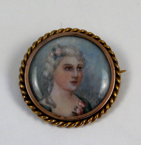 Appraisal: GOLD FRAMED PORTRAIT BROOCH The portrait of a young lady