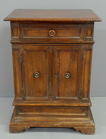 Appraisal: Italian walnut cabinet th c with a molded top above