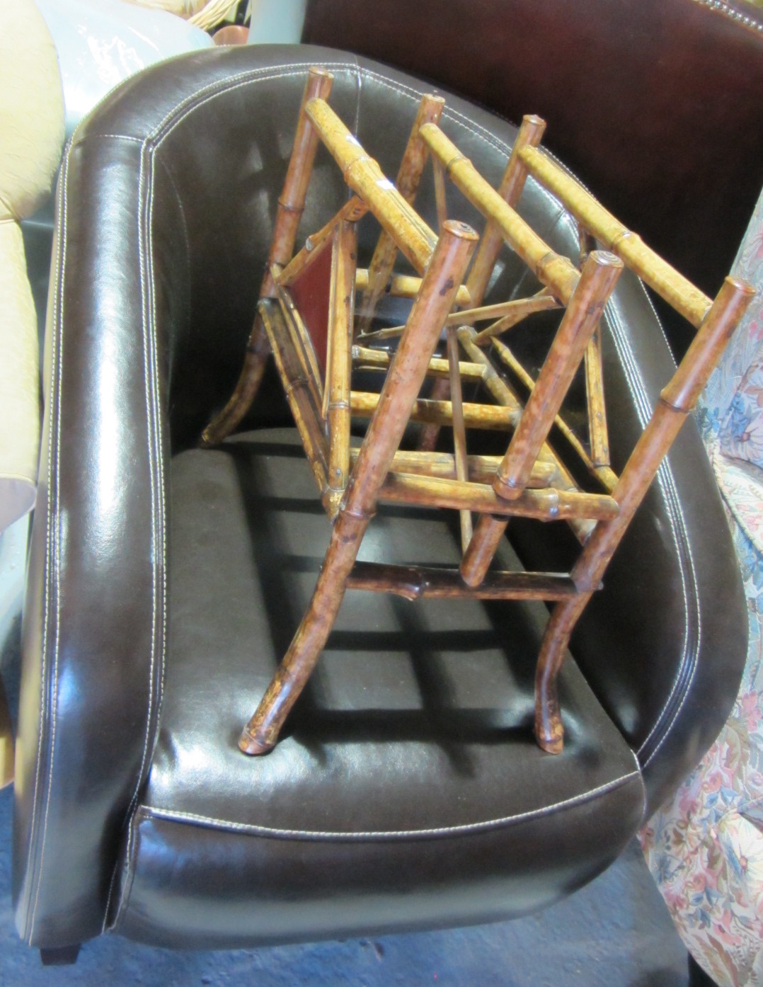 Appraisal: A th century brown leather tub armchair and a bamboo