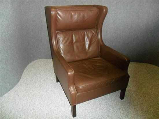 Appraisal: MOGENS HANSEN A DANISH DARK BROWN LEATHER WING-BACK ARMCHAIR