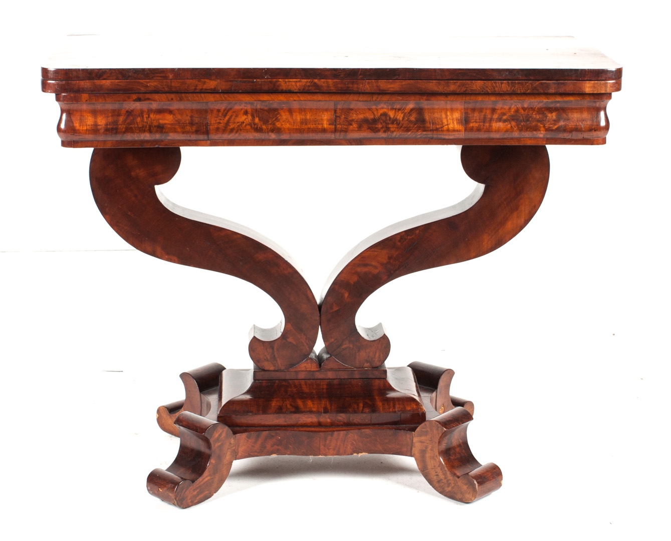 Appraisal: American Restoration mahogany flip-top games table circa volute supports and