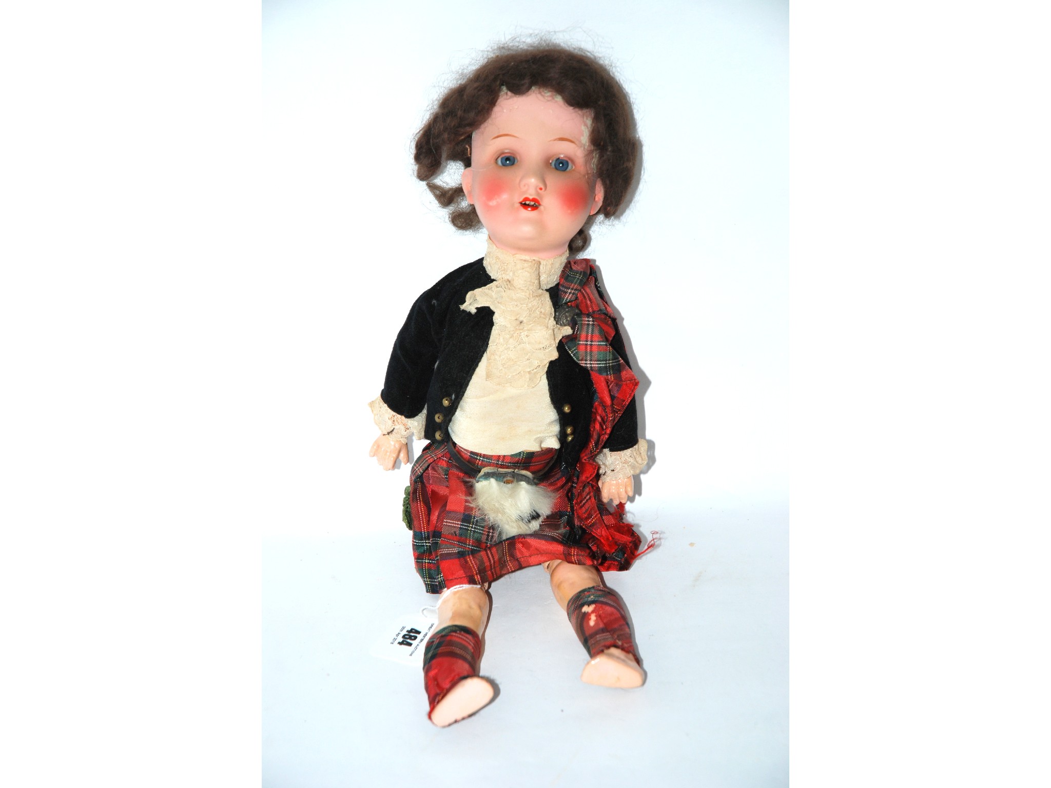 Appraisal: An Armand Marseille bisque-headed doll dressed in highland dress