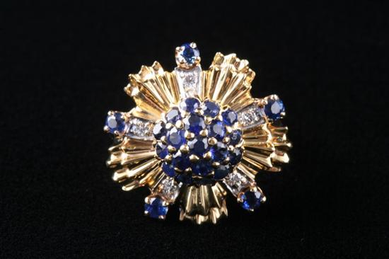 Appraisal: K YELLOW GOLD SAPPHIRE AND DIAMOND COCKTAIL RING Round floral