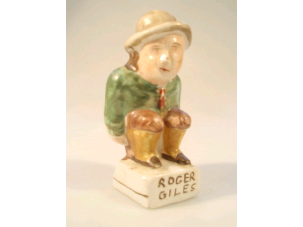 Appraisal: A humourous Staffordshire character figure inscribed Roger Giles cm high