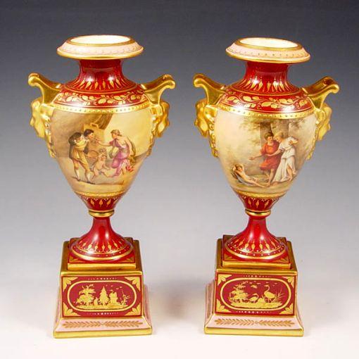 Appraisal: PAIR AUSTRIAN HAND PAINTED URNS Artist signed Grunol Series of