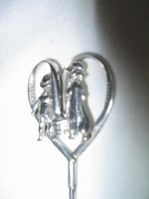 Appraisal: A SILVER HAT PIN moulded as Jack and Jill within