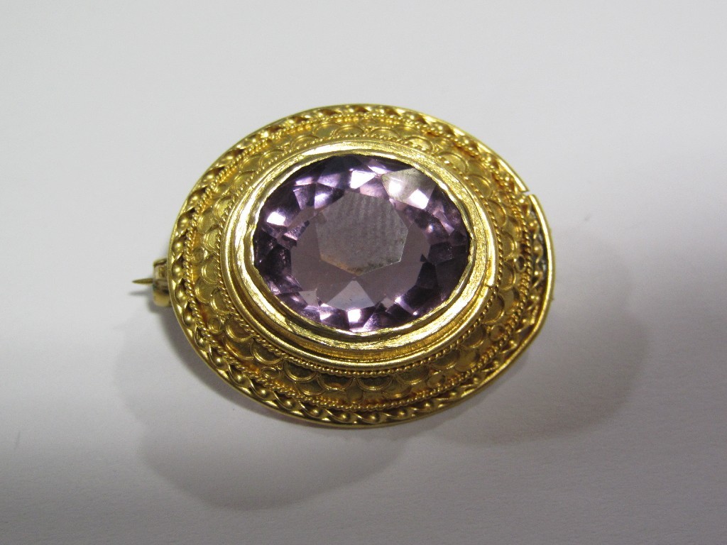 Appraisal: Victorian amethyst brooch in yellow metal circular mount with embossed