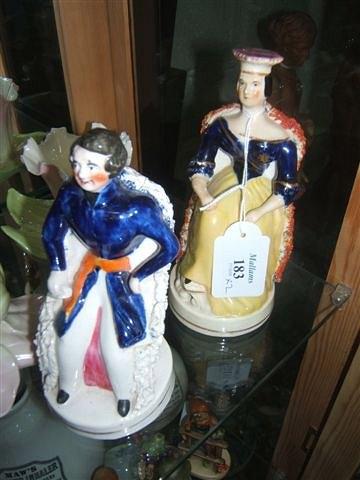 Appraisal: A pair of Victorian Staffordshire figures of Queen Victoria and