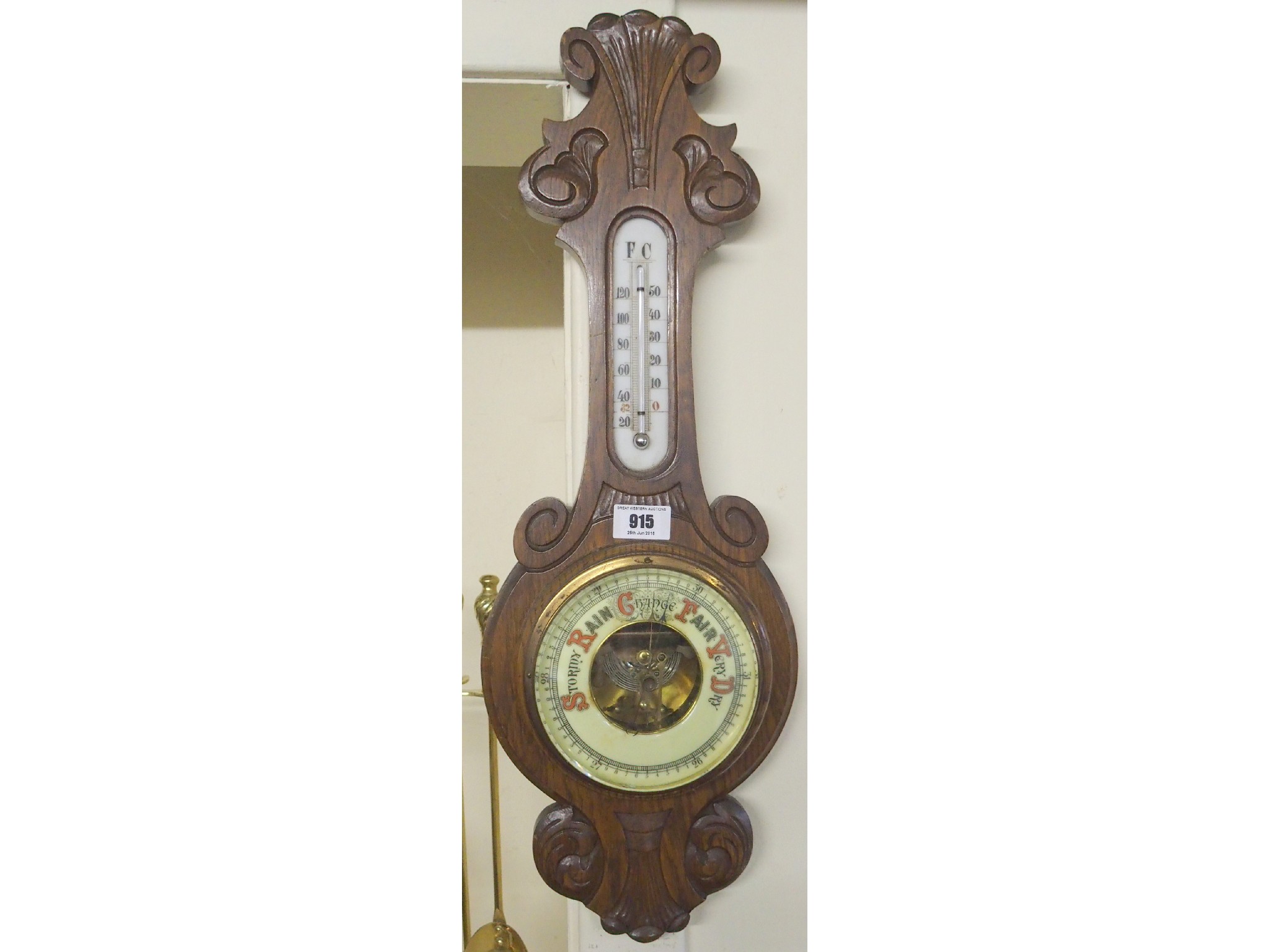 Appraisal: An oak wall barometer thermometer