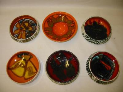 Appraisal: FIVE VARIOUS POOLE POTTERY BOWLS in Delphis design wide and