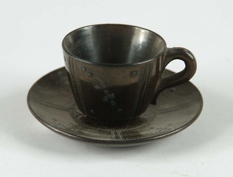 Appraisal: SMALL JACKFIELD TYPE CUP AND SAUCER Saucer has impresses rosette