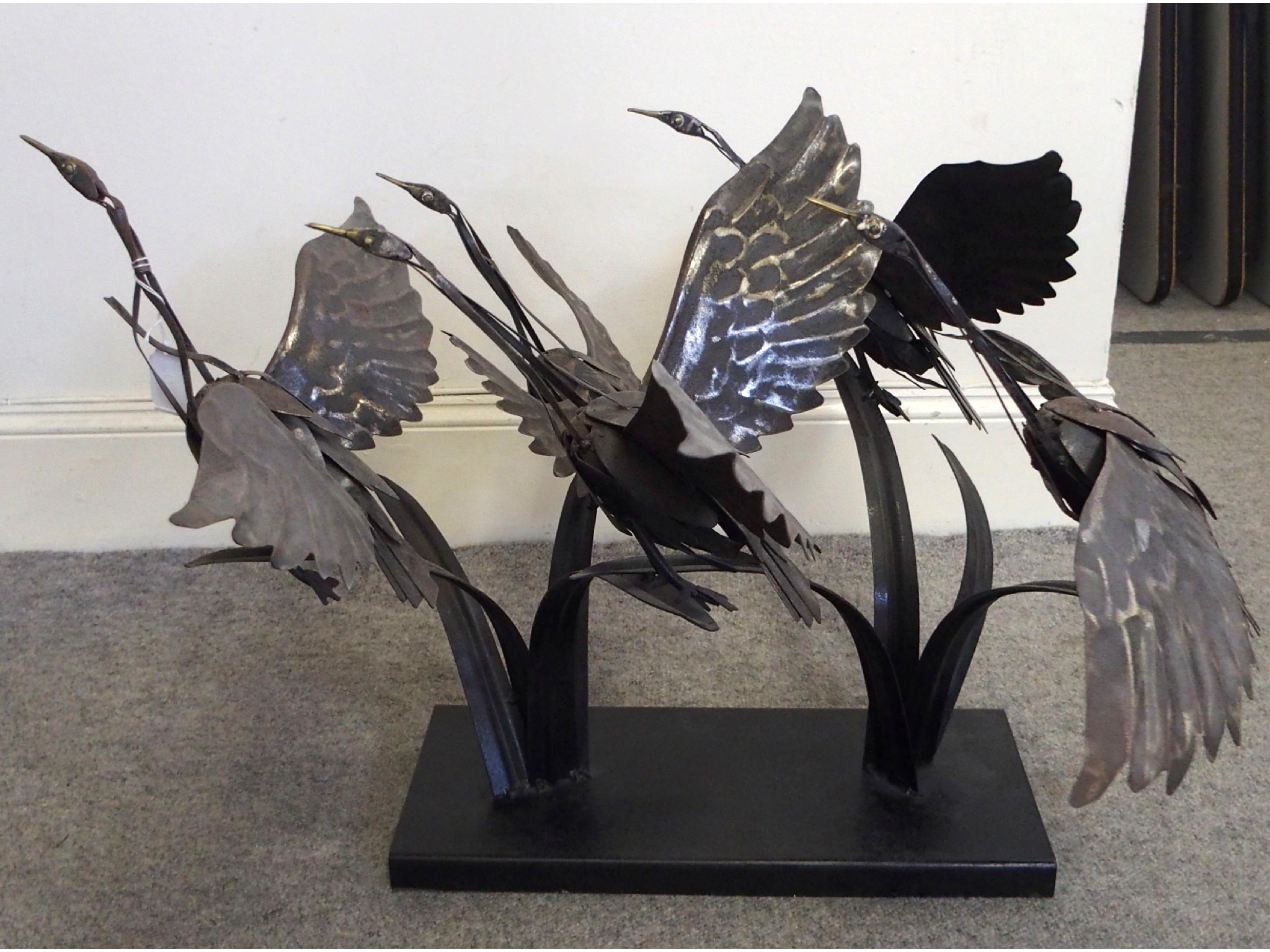 Appraisal: Metal sculpture of birds in flight