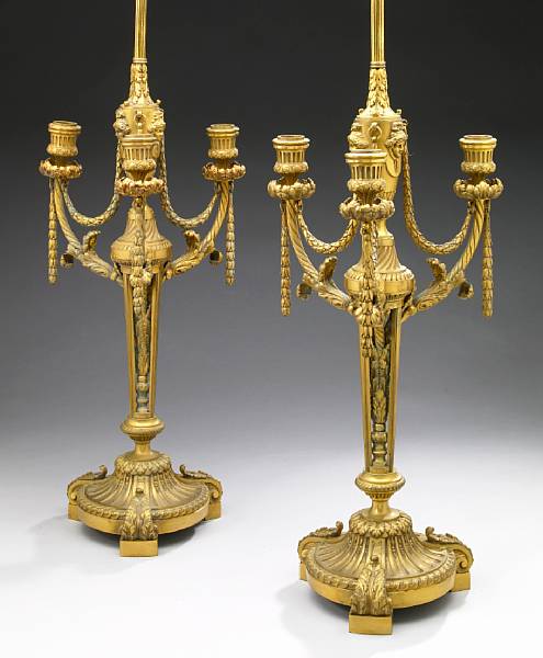 Appraisal: A pair of Louis XVI style gilt bronze three light